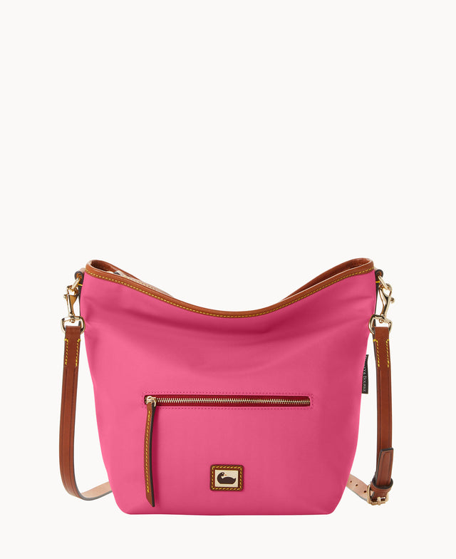 A bright pink crossbody bag with brown leather strap and trim, a front zippered pocket with a leather pull, and gold-tone hardware, set against a plain white background.