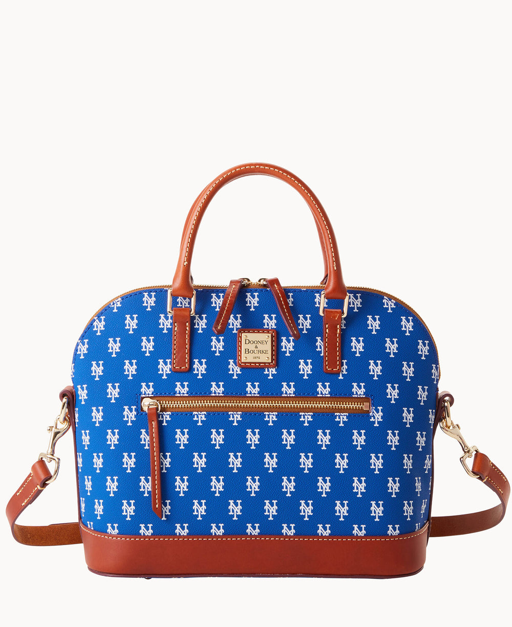 A blue handbag with brown leather handles and trim, featuring an all-over white NY logo pattern, a front zippered pocket, and a detachable shoulder strap.