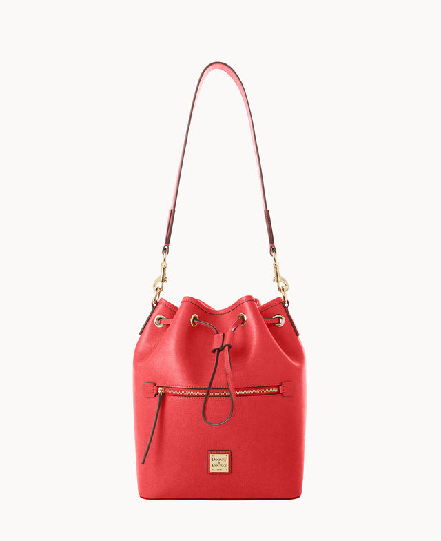 A red leather bucket bag with a top handle, gold hardware, front zip pocket, drawstring closure, and a small branded logo plate near the base.
