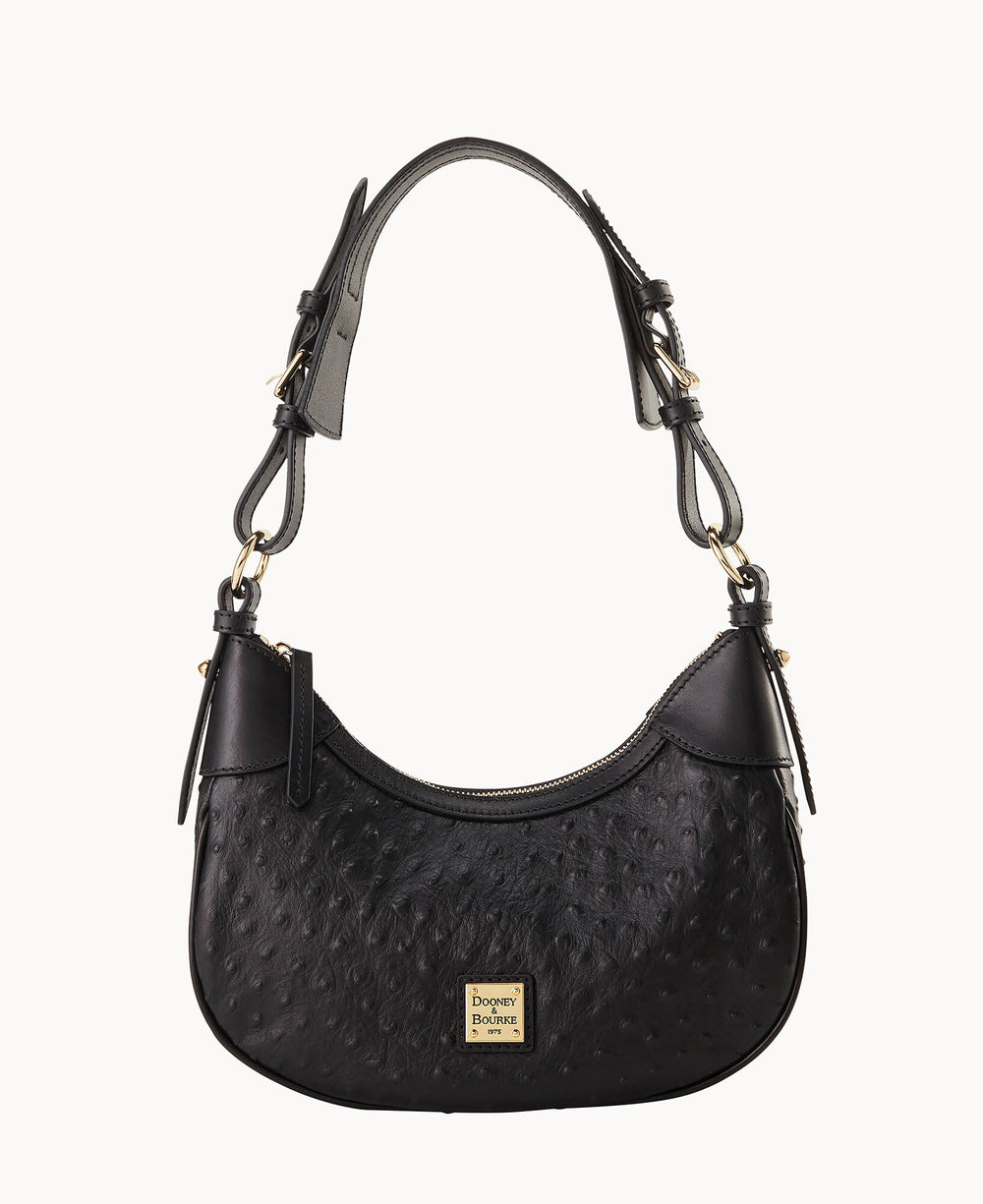 A black leather handbag with a textured surface, adjustable shoulder strap, gold-tone hardware, and a small gold logo plaque on the front reading “Dooney & Bourke.â€.