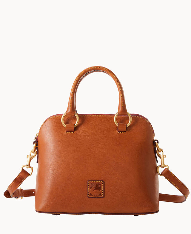 A medium-sized, brown leather handbag with two handles, gold hardware, a detachable shoulder strap, and a small stitched logo patch on the front. The bag has a structured, rounded shape and a zippered top closure.