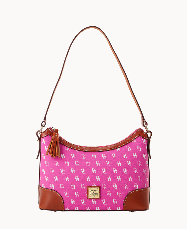 Bright pink shoulder bag featuring white Dooney & Bourke DB logo pattern with brown leather corners