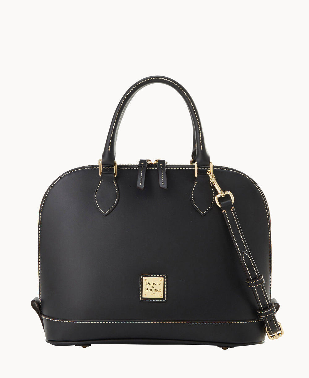 A black leather handbag with double top handles, gold hardware, a detachable shoulder strap, contrast stitching, and a square gold Dooney & Bourke logo plate on the front.