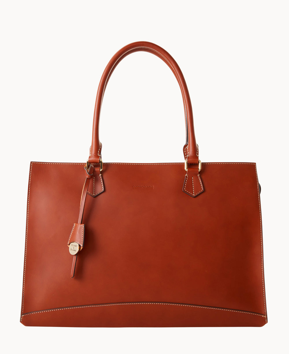 A large, structured brown leather handbag with two handles, gold hardware, and visible white stitching around the edges, set against a plain white background.