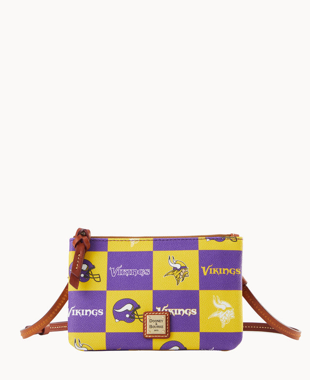 A small crossbody bag with a brown strap, decorated with purple and yellow checkerboard squares, Minnesota Vikings logos, and the word Vikings. A Dooney & Bourke label is on the front.