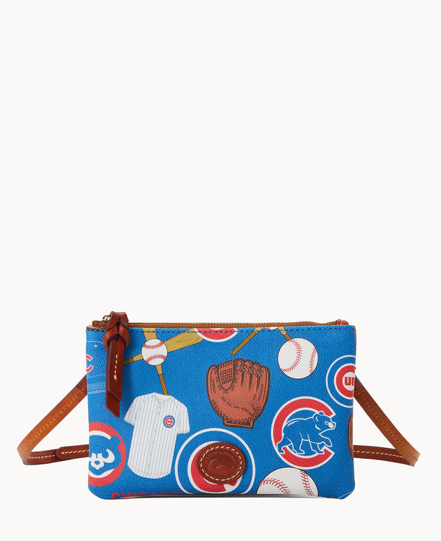 A small blue crossbody bag with brown leather strap, featuring a baseball-themed print with bats, balls, gloves, jerseys, and Chicago Cubs logos. The bag has a zipper closure with a leather pull tab.