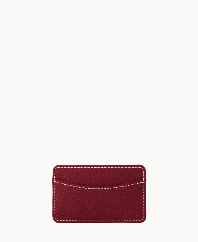 A small, rectangular, textured red leather cardholder with white stitching along the edges, shown against a plain white background.