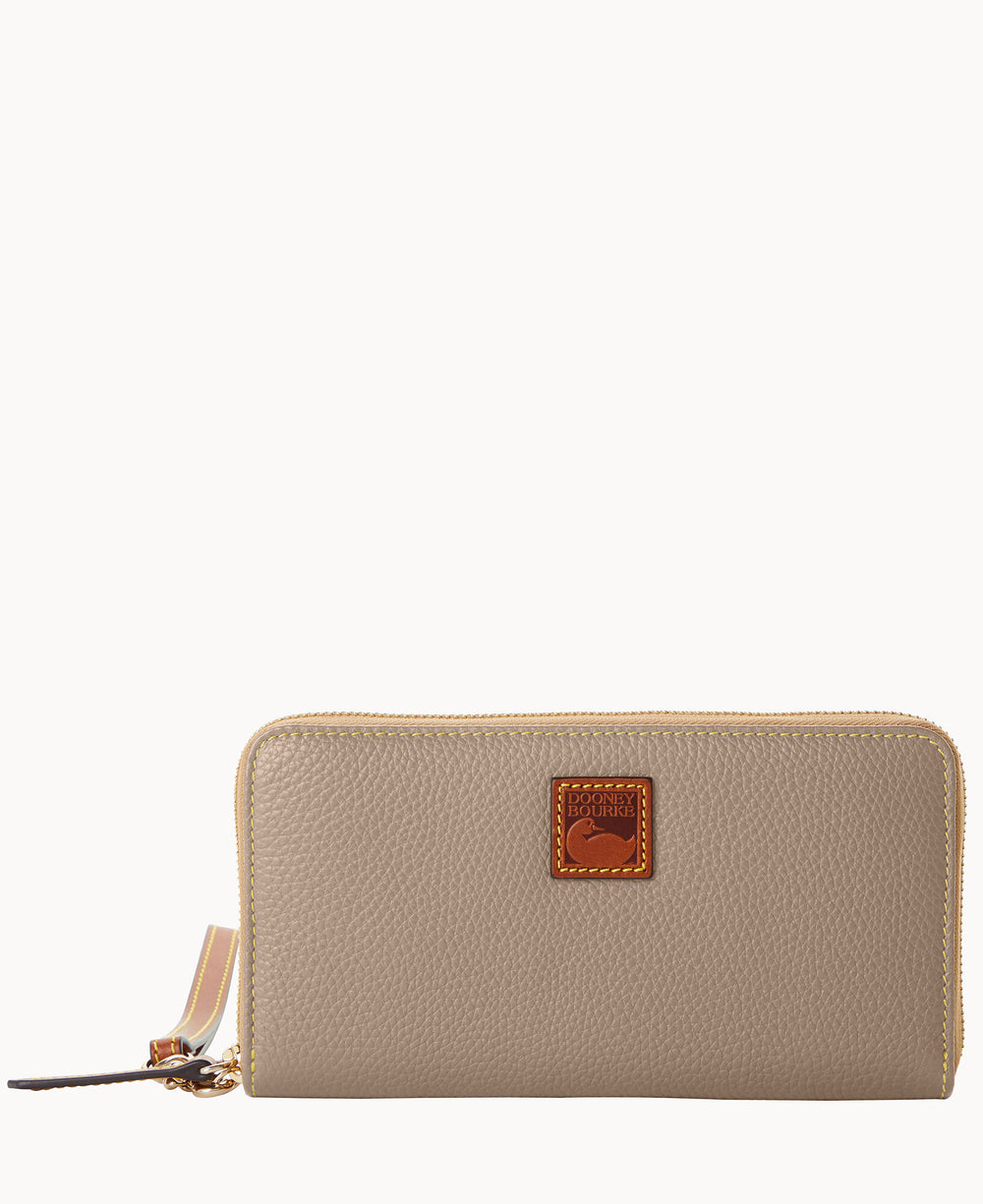 A beige zip-around leather wallet with a textured surface, gold zipper, wrist strap, and a brown square logo patch featuring a duck emblem in the center front.