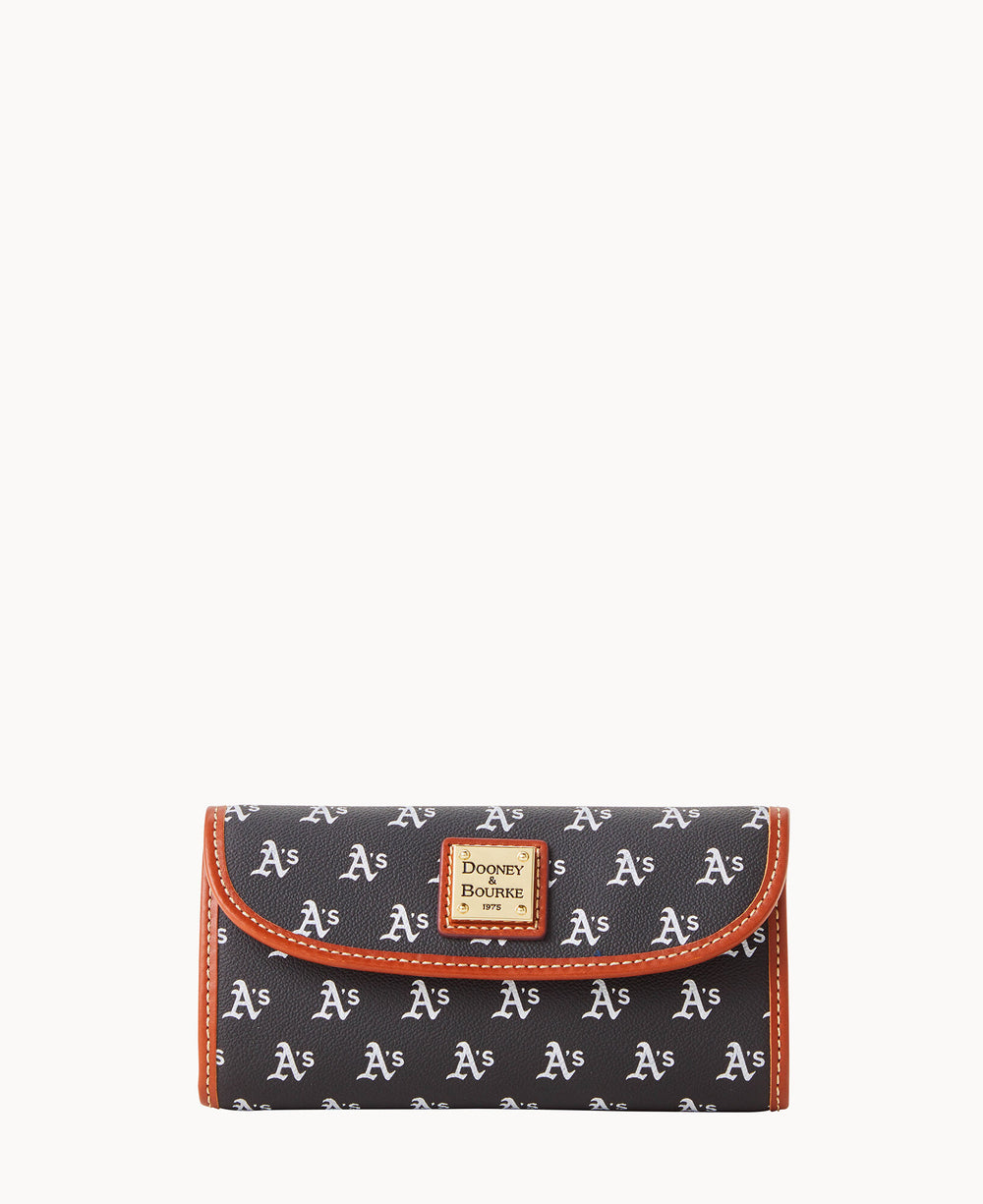 A black Dooney & Bourke wallet featuring a repeating white As logo pattern with brown trim and a gold label on the front, isolated on a white background.