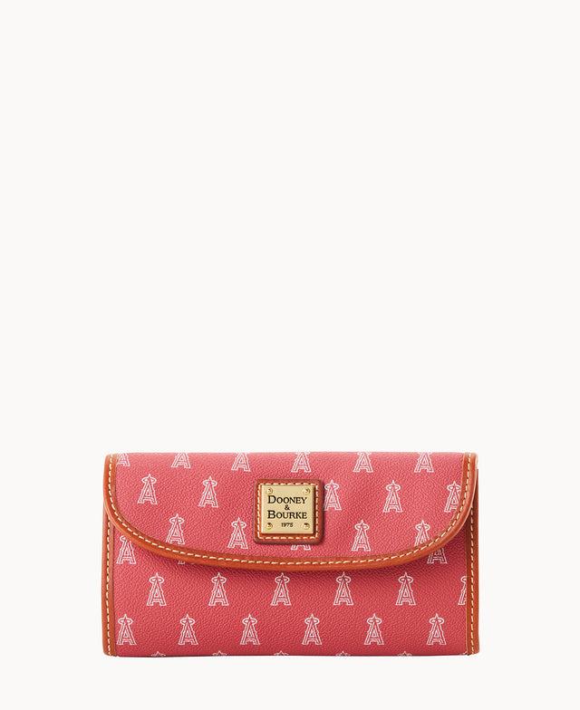 A pink Dooney & Bourke wallet with a brown trim and small white repeating A-shaped icons. The wallet features a gold square logo plaque on the front.