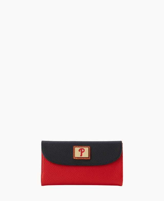 A rectangular wallet with a textured red body and a black flap, featuring a gold label with a red letter P on the front center.