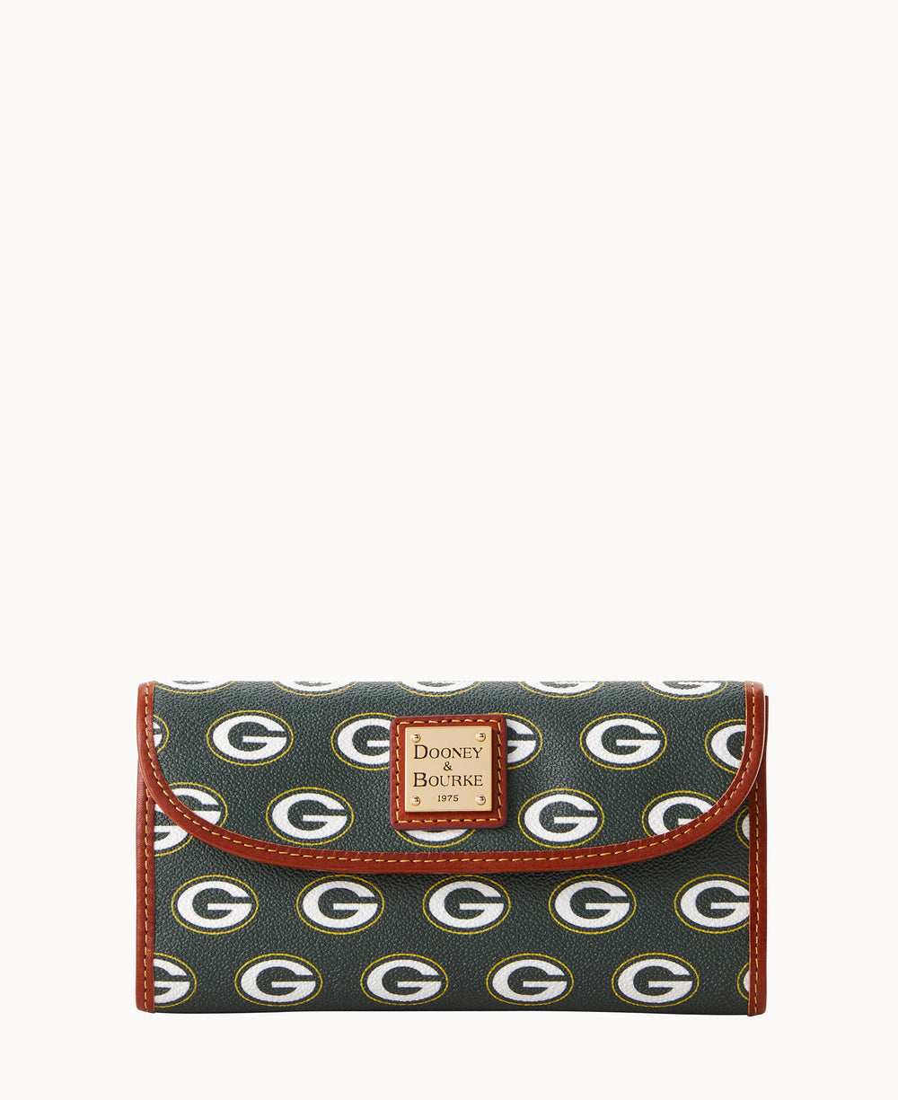 A Dooney & Bourke wallet featuring a pattern of Green Bay Packers G logos on a dark background, with brown trim and a logo patch on the flap.