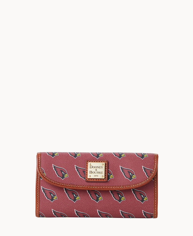 A maroon wallet with a brown trim, featuring repeating Arizona Cardinals logos and a gold Dooney & Bourke label on the front.