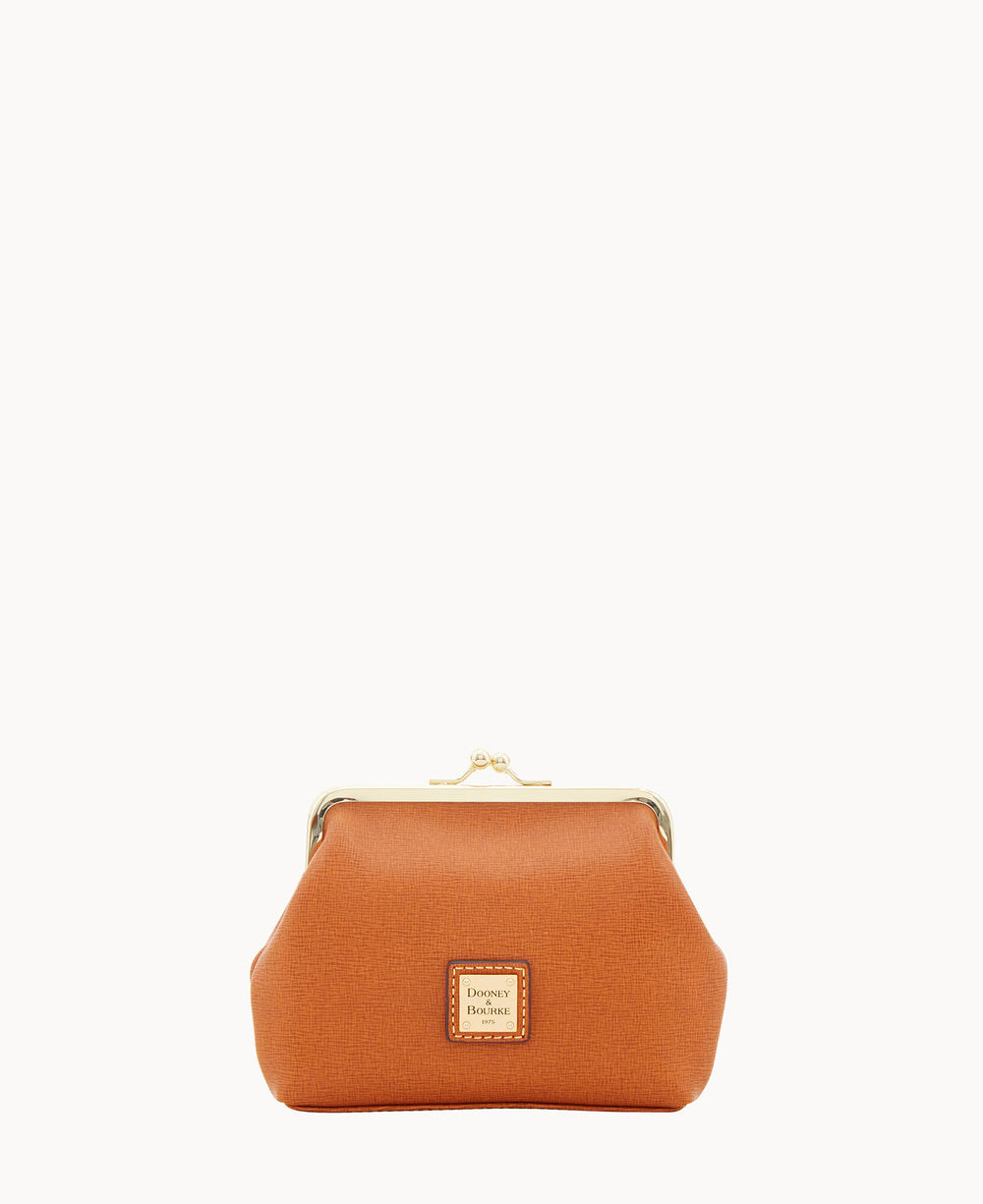 A small, structured, orange leather coin purse with a gold clasp and a Dooney & Bourke logo patch on the front, set against a plain white background.