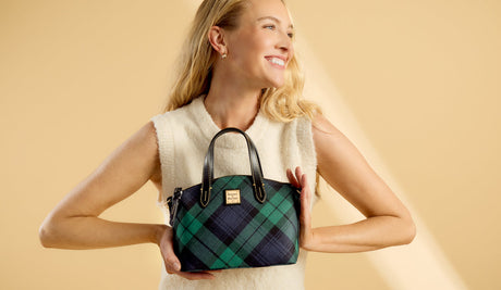 Woman holding small Tartan Satchel