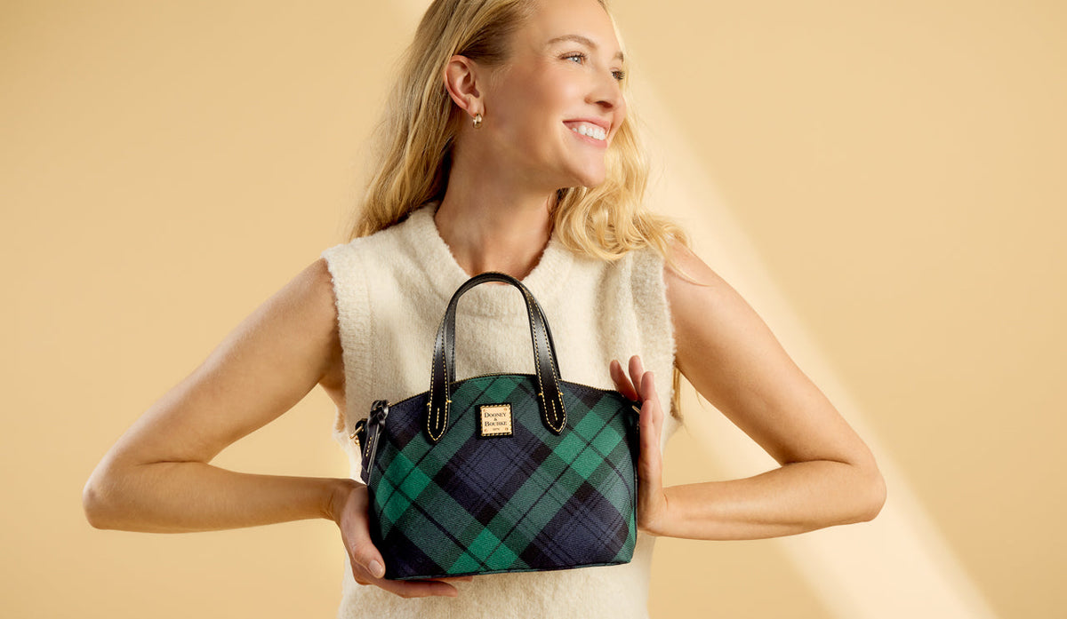 Woman holding small Tartan Satchel