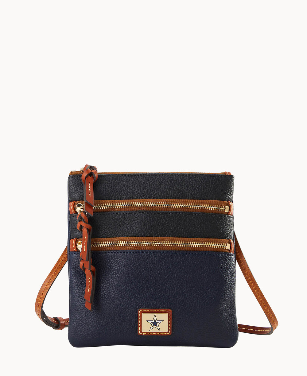 Dallas Cowboys navy leather crossbody purse with brown accents, gold zippers, and adjustable strap