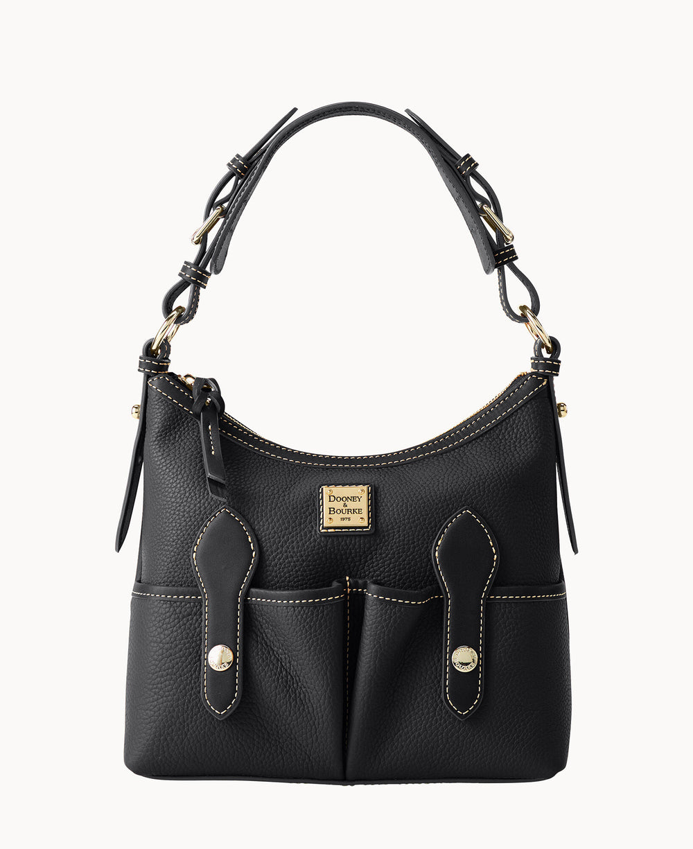 A black leather Dooney & Bourke handbag with gold hardware, two front pockets with flap and snap closures, adjustable shoulder strap, and beige contrast stitching.
