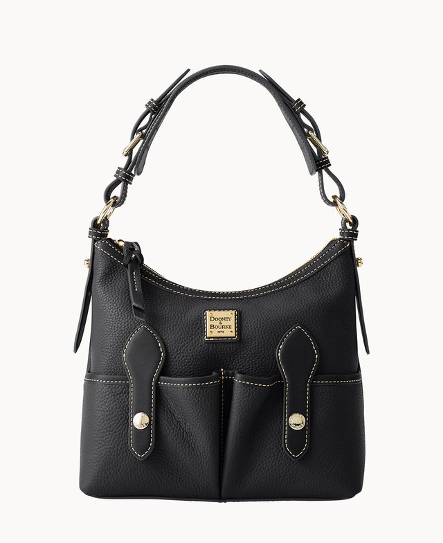 A black leather Dooney & Bourke handbag with gold hardware, two front pockets with flap and snap closures, adjustable shoulder strap, and beige contrast stitching.
