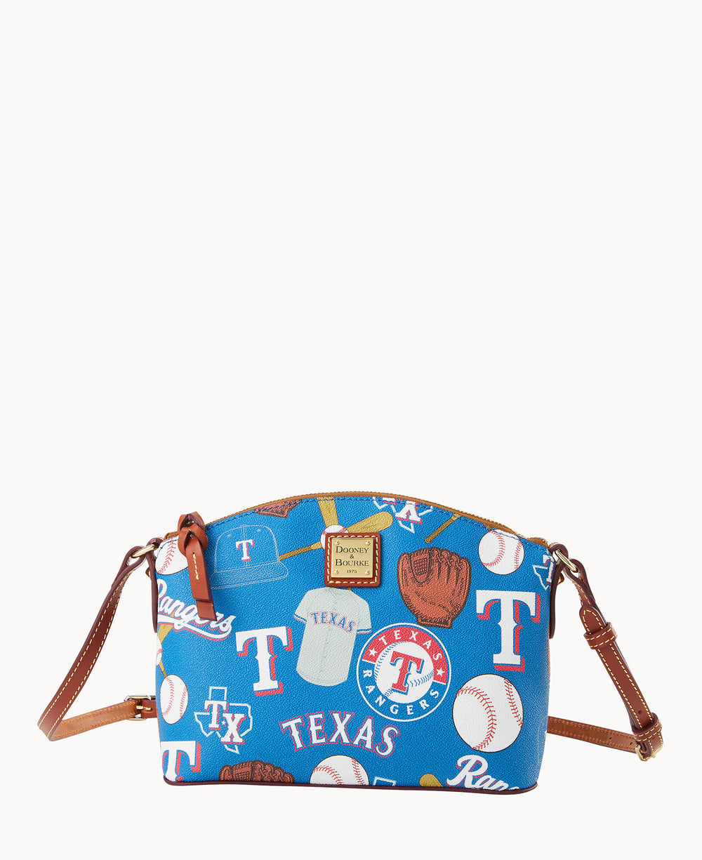 A blue crossbody bag with brown leather straps, featuring Texas Rangers logos, baseballs, gloves, caps, and the word Rangers in various fonts and colors.