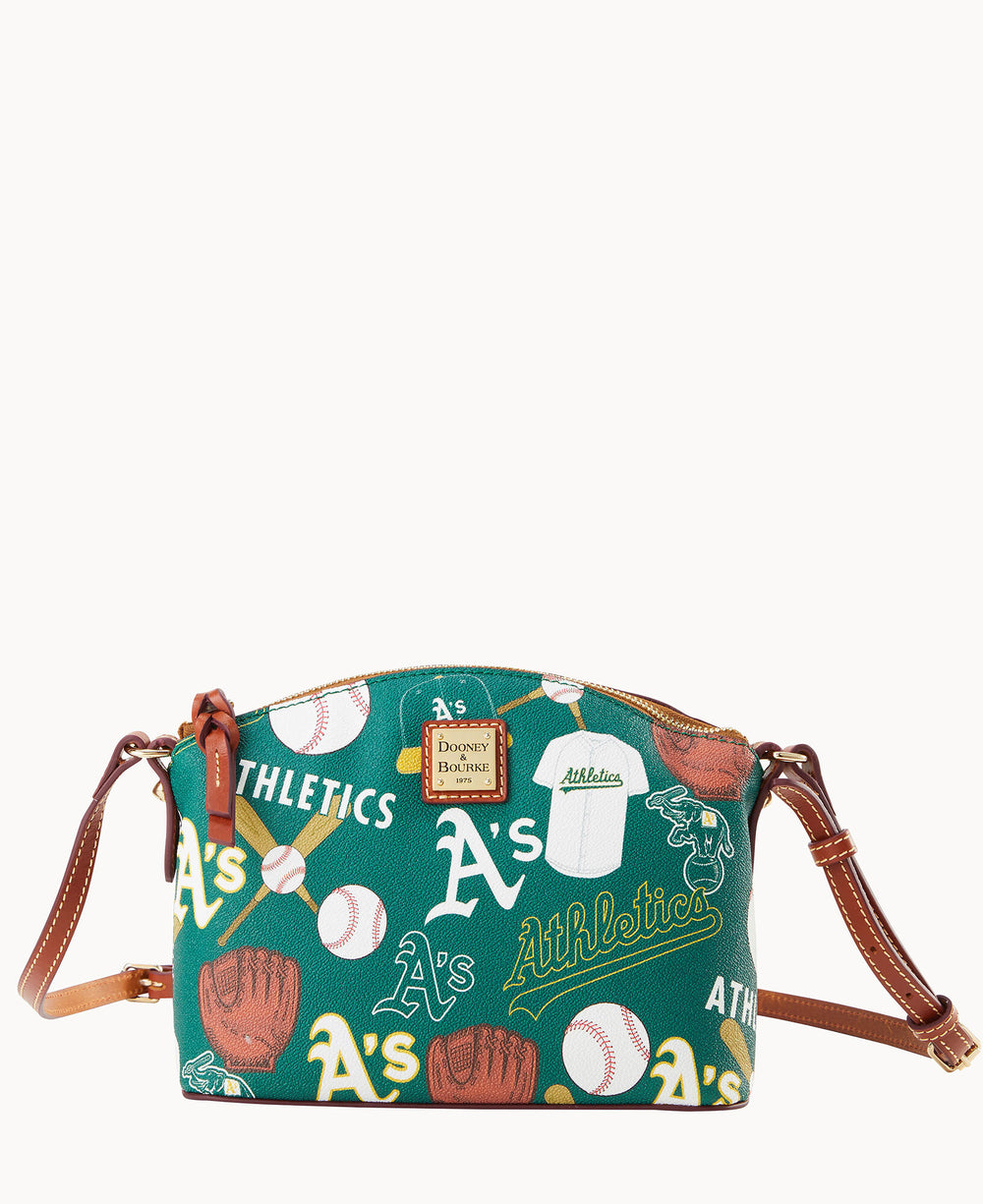 Green crossbody bag with brown leather straps, featuring illustrations of baseballs, gloves, jerseys, and multiple As logos and Athletics text, representing the Oakland Athletics baseball team.
