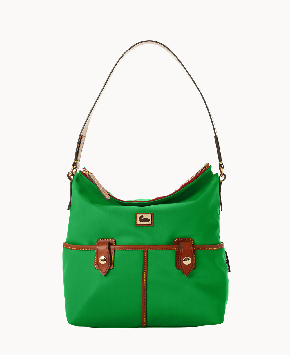 A green handbag with brown leather trim, two front pockets with buckle details, gold hardware, and a single tan shoulder strap, set against a plain white background.