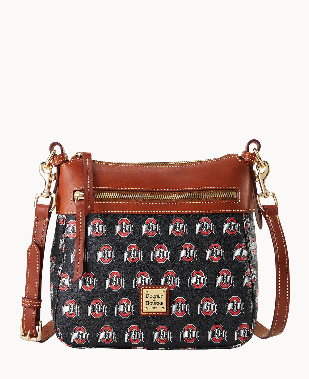 A black crossbody bag with brown leather accents and gold hardware, featuring a repeating Ohio State logo pattern and a front zip pocket. The brand label Dooney & Bourke is on the front.