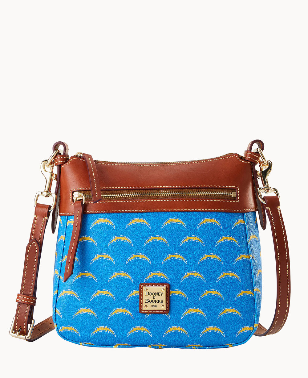 A blue crossbody bag with a brown leather strap and trim, decorated with repeating yellow and white lightning bolt logos, and featuring a gold Dooney & Bourke label on the front.