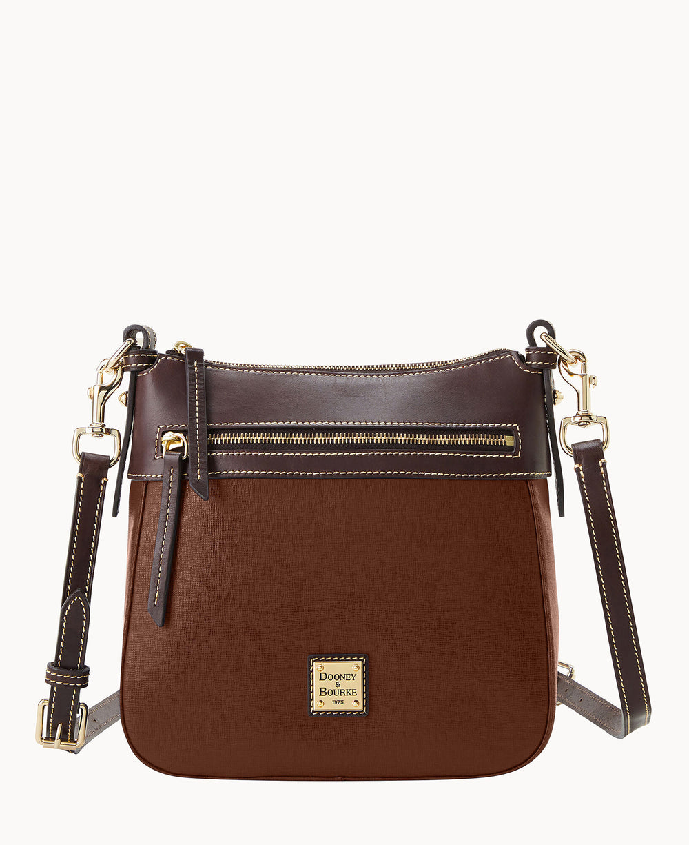 A brown leather crossbody bag with dark brown trim, a front zippered pocket, gold-tone hardware, adjustable strap, and a Dooney & Bourke logo patch on the front.