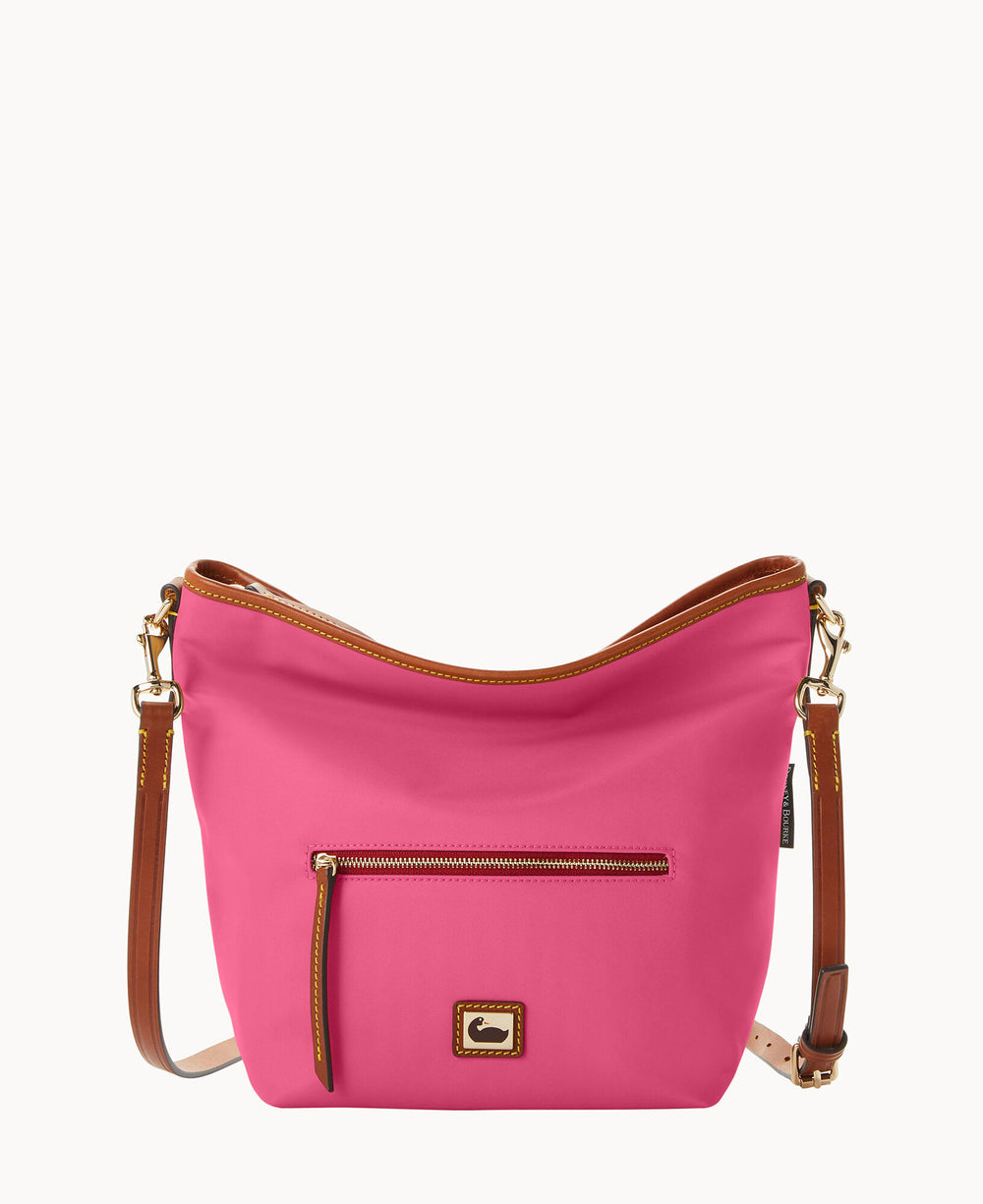 A bright pink crossbody bag with brown leather strap and trim, a front zippered pocket with a leather pull, and gold-tone hardware, set against a plain white background.