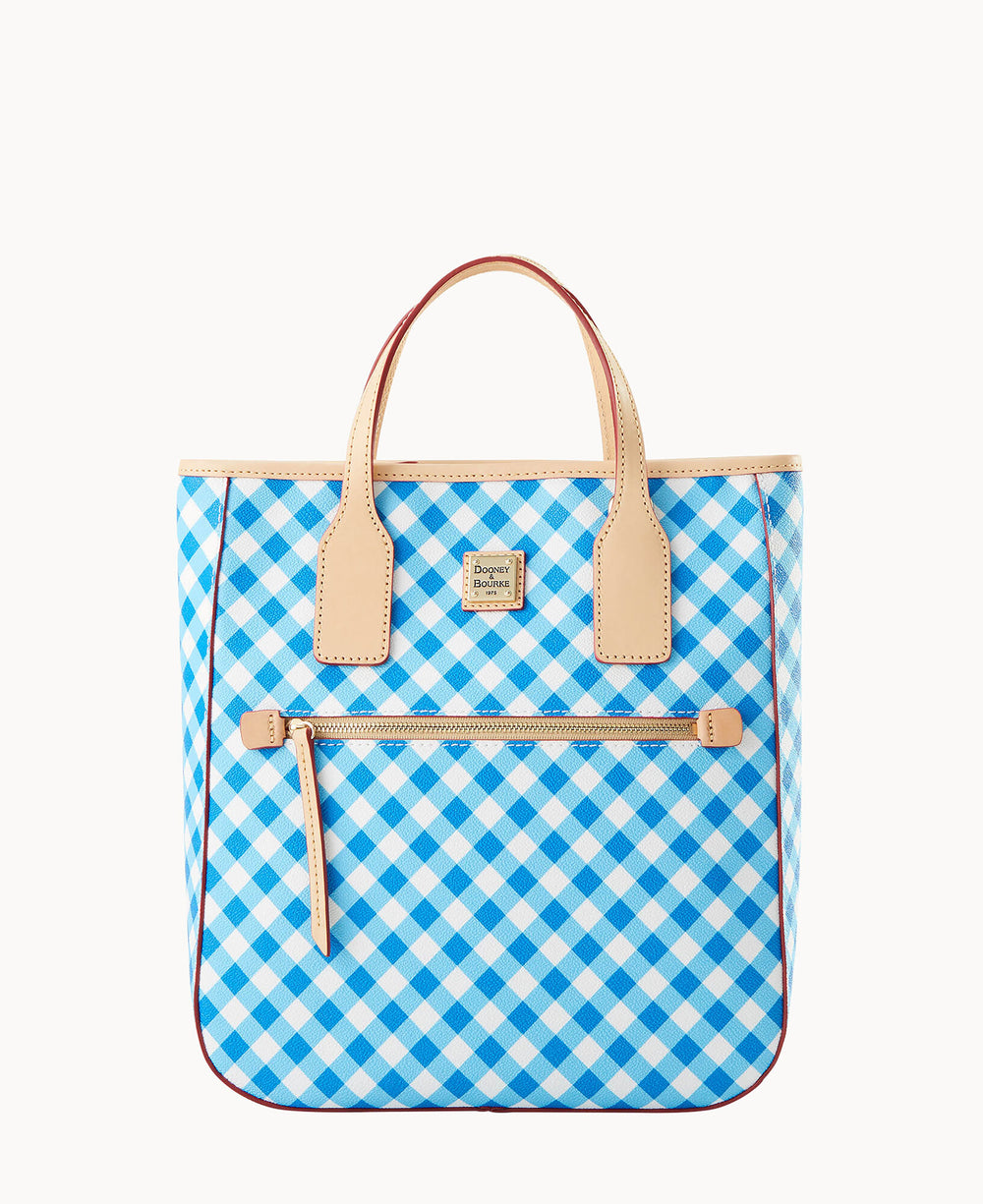 A tote bag with tan leather handles and trim, featuring a blue and white checkered pattern and a front zip pocket.