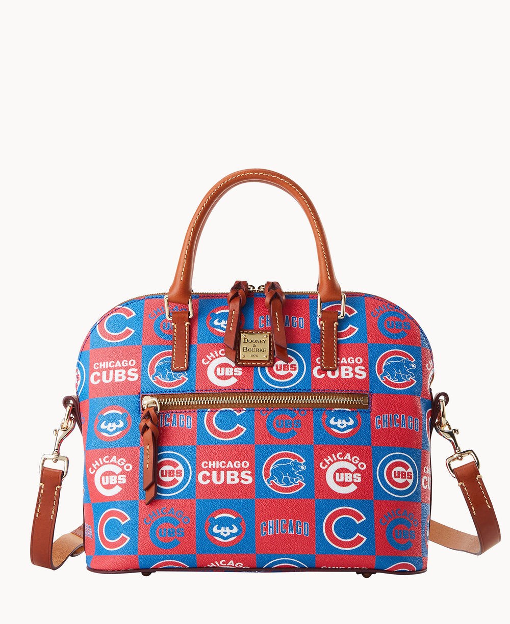 A handbag with brown leather handles and trim, featuring a blue and red checkerboard pattern with Chicago Cubs logos and text. The bag has a front zipper pocket and a detachable shoulder strap.
