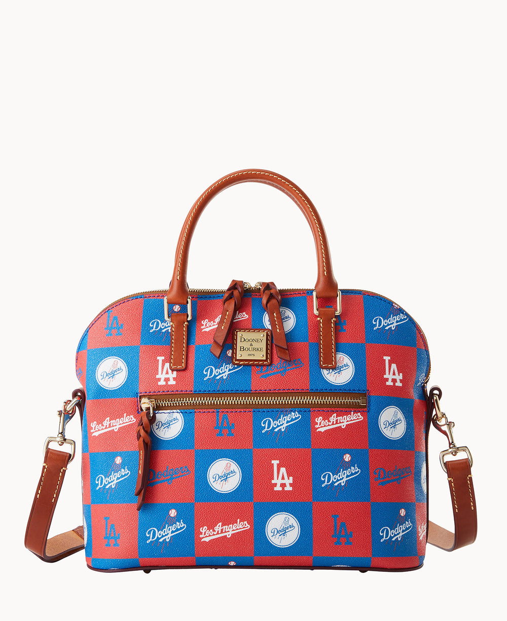 A satchel handbag with brown leather handles and strap, featuring a red and blue checkered pattern with Los Angeles Dodgers logos and text on each square.