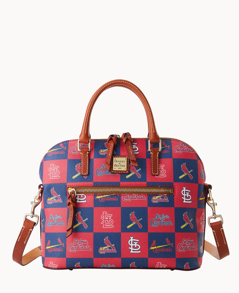A square, top-handle handbag with a blue and red checkered pattern featuring St. Louis Cardinals logos and text. The bag has brown leather handles, gold hardware, and a detachable shoulder strap.