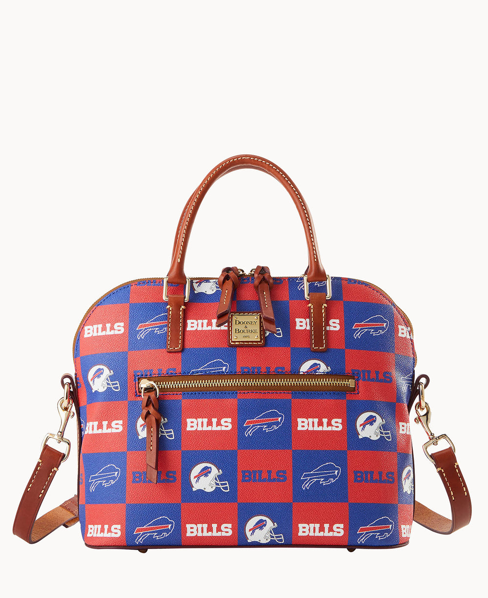 A dome-shaped handbag with brown leather handles and trim, featuring a red and blue checkered pattern with BILLS text and buffalo logos. The bag has a front zipper pocket and an adjustable shoulder strap.