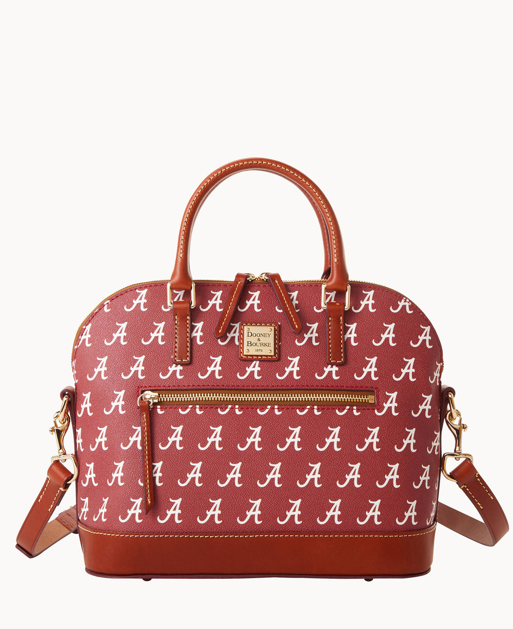 A maroon handbag with brown leather handles and trim, featuring a repeating white A logo. The bag has a front zipper pocket and a detachable shoulder strap.