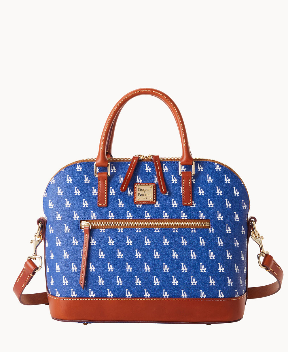 A blue handbag with brown leather handles and trim, featuring an all-over white LA logo pattern, a front zipper pocket, and a detachable shoulder strap.