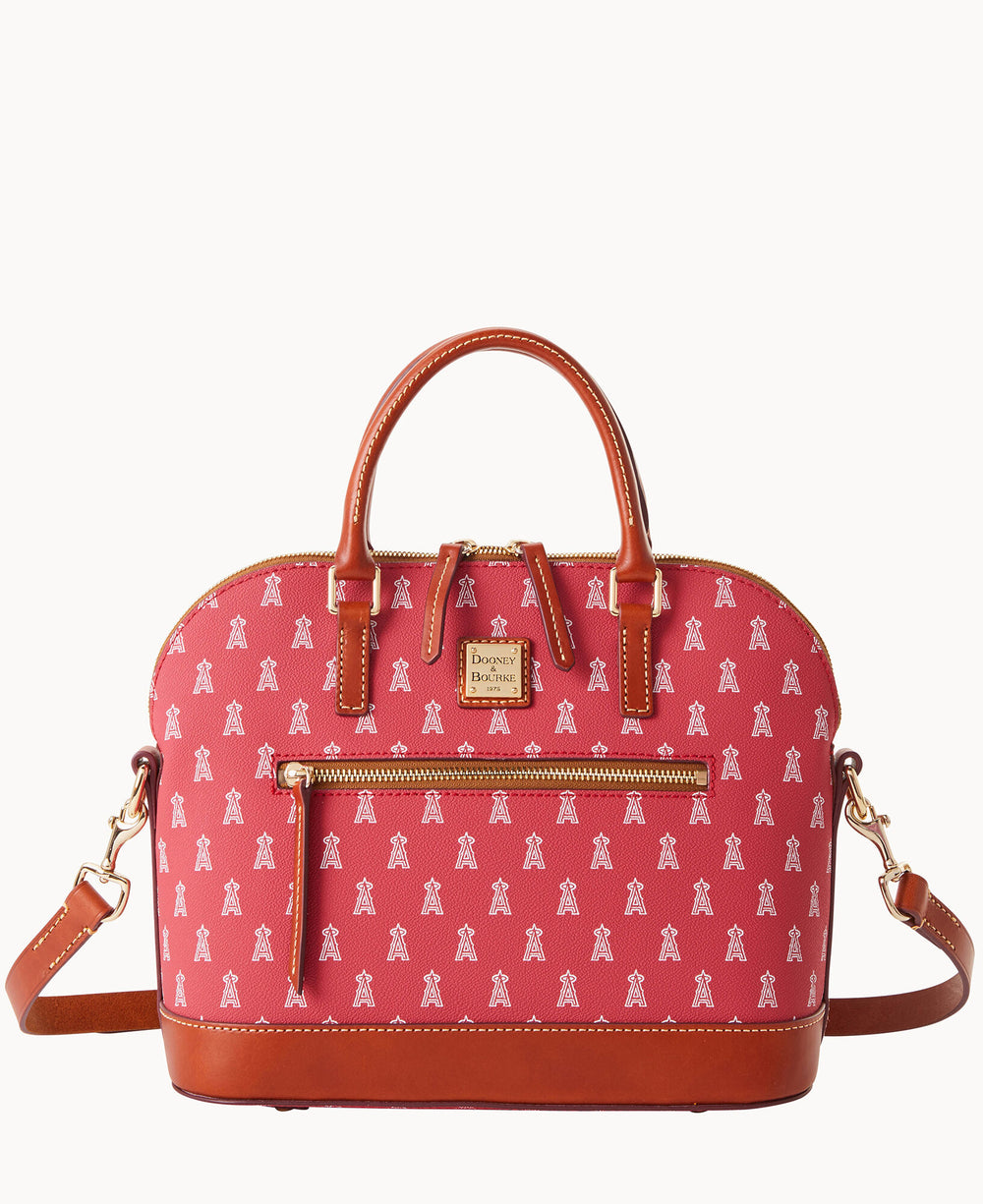 A red handbag with brown leather handles and trim, featuring a front zipper pocket, gold-tone hardware, an adjustable shoulder strap, and a repeating white A logo pattern.