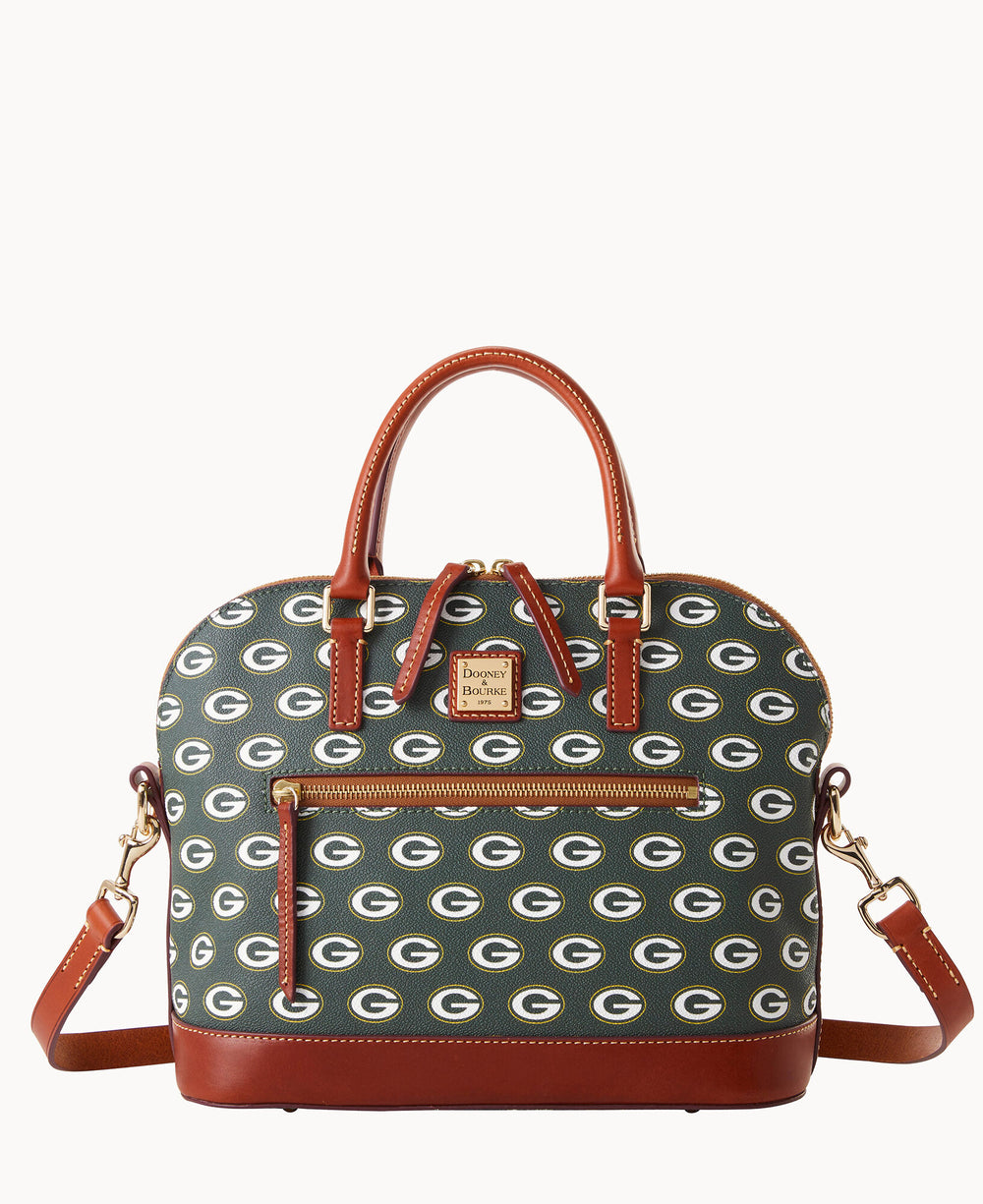 A green and brown handbag with tan leather handles and trim, featuring a repeating Green Bay Packers G logo pattern, a front zipper pocket, and a detachable shoulder strap.