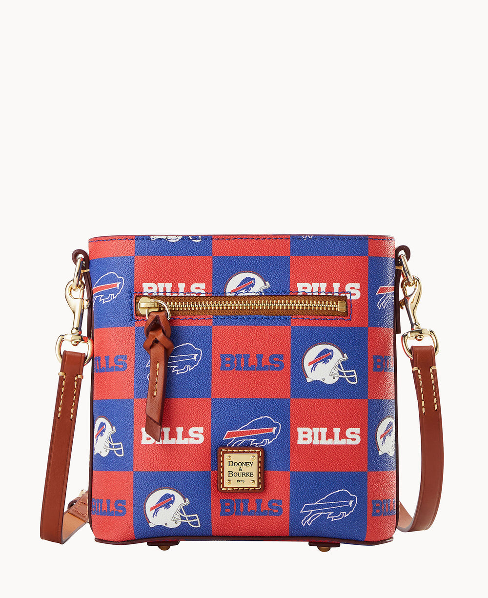 A small crossbody bag with a blue and red checkered pattern featuring â€œBILLSâ€ text and Buffalo Bills football team logos, with brown leather straps and a front zipper pocket.