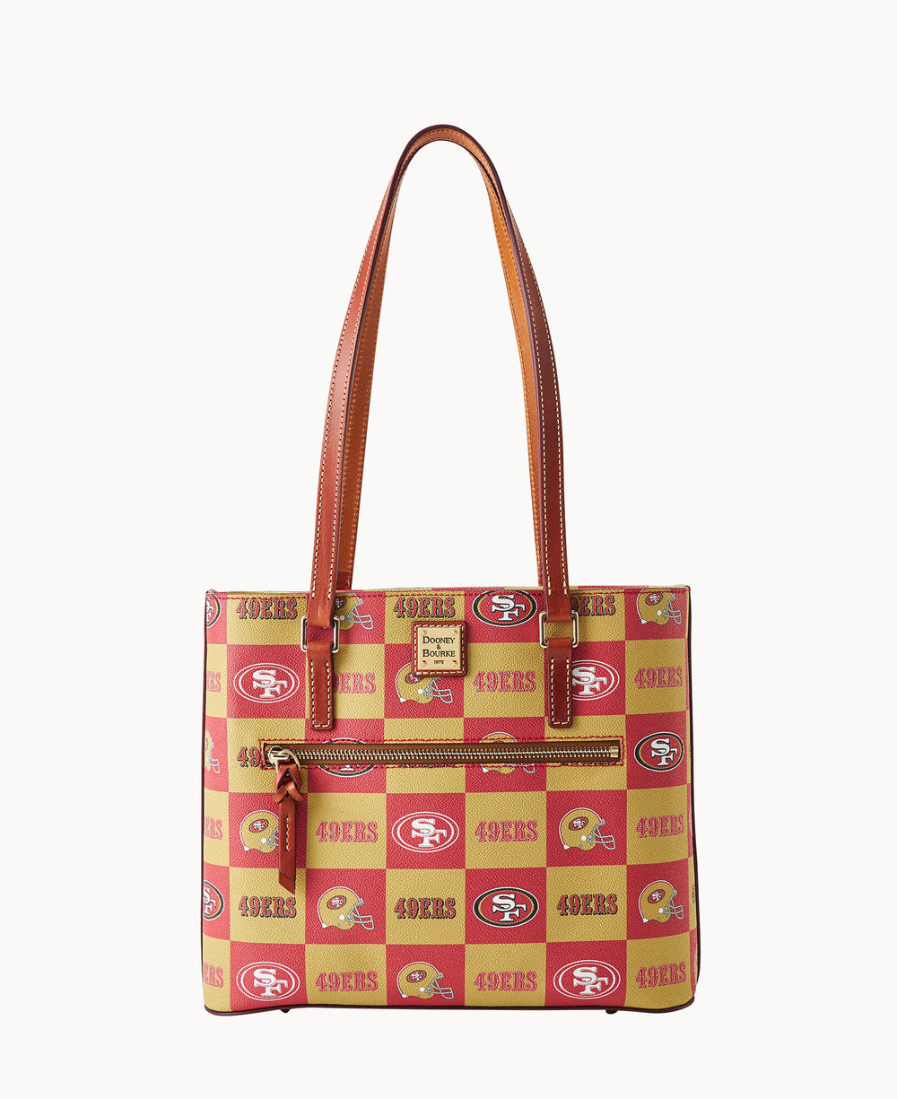 A red and gold handbag with brown straps featuring San Francisco 49ers logos, football helmets, and 49ERS text in a repeating pattern. The bag has an exterior zipper pocket and a Dooney & Bourke logo plaque.
