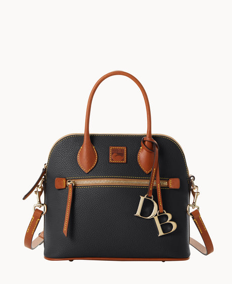 A black leather handbag with brown handles and trim, gold zipper, and gold DB letter charms hanging from one handle. The bag has a structured shape and an exterior front pocket.