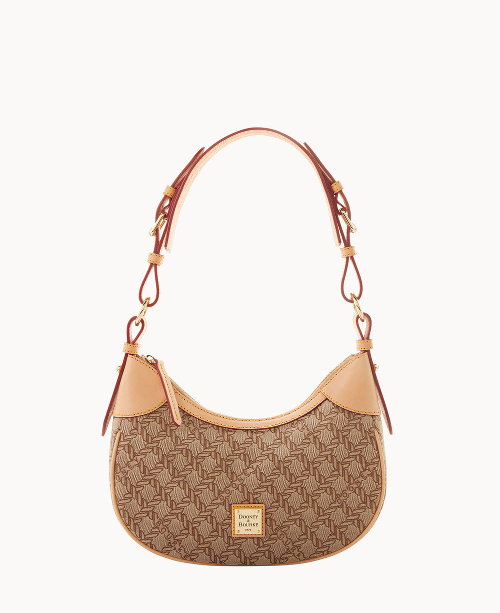 A small, brown designer shoulder bag with a monogram pattern, tan leather trim, gold hardware, and a short handle with buckle details. The brand logo is displayed on a square patch on the front.