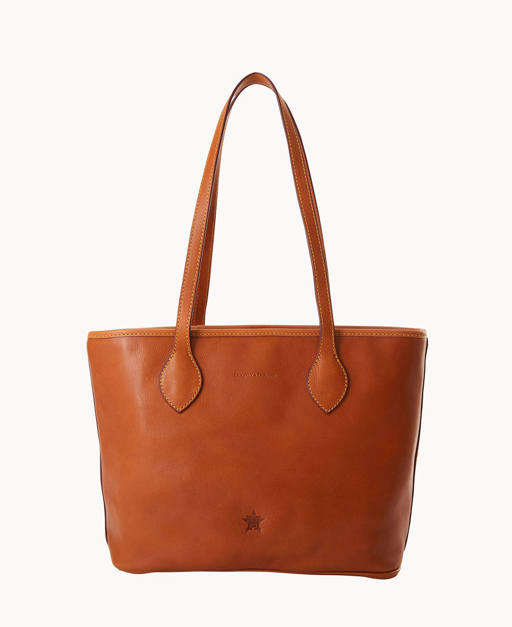 A brown leather tote bag with two long handles, simple stitching, and a small star-shaped detail near the bottom center. The surface is smooth with minimal design elements.