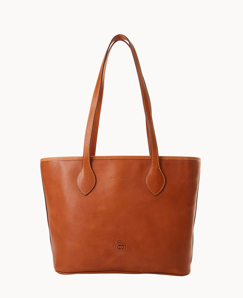 A brown leather tote bag with two long handles, featuring minimal stitching and a small embossed logo near the bottom center. The background is plain white.