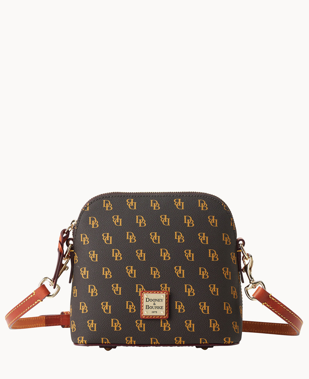 A small, brown Dooney & Bourke crossbody bag with a gold DB monogram pattern, brown leather strap, and gold hardware, displayed against a plain white background.