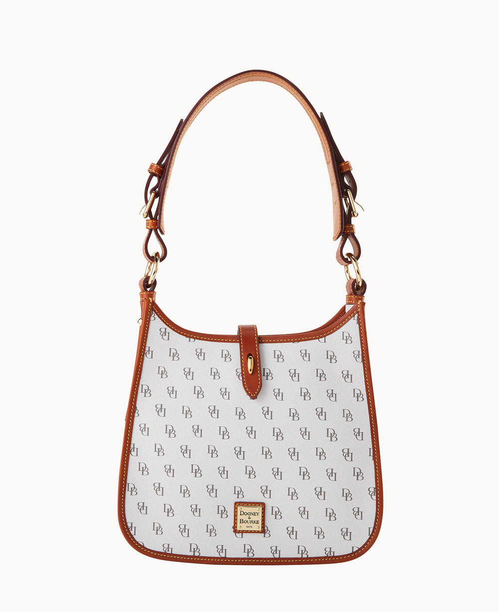A white handbag with a brown leather strap and trim, featuring a repeating monogram pattern and a gold Dooney & Bourke logo plaque on the front.