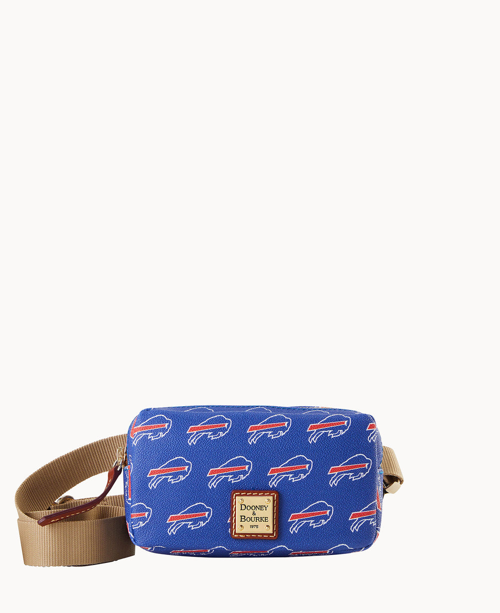 A blue Dooney & Bourke crossbody bag with repeating Buffalo Bills logos and a tan adjustable strap. The brandâ€™s leather patch is on the front.
