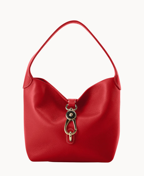 A red leather handbag with a single wide strap and a gold-tone decorative clasp on the front, set against a plain white background.