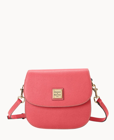 A small, pink crossbody bag with a flap closure, gold-tone hardware, and a square Dooney & Bourke logo plate on the front. The bag has an adjustable strap and a structured shape.